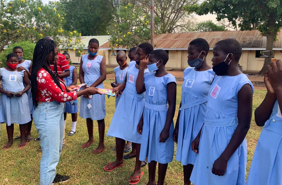 a group of primary school girls wearing blue dresses